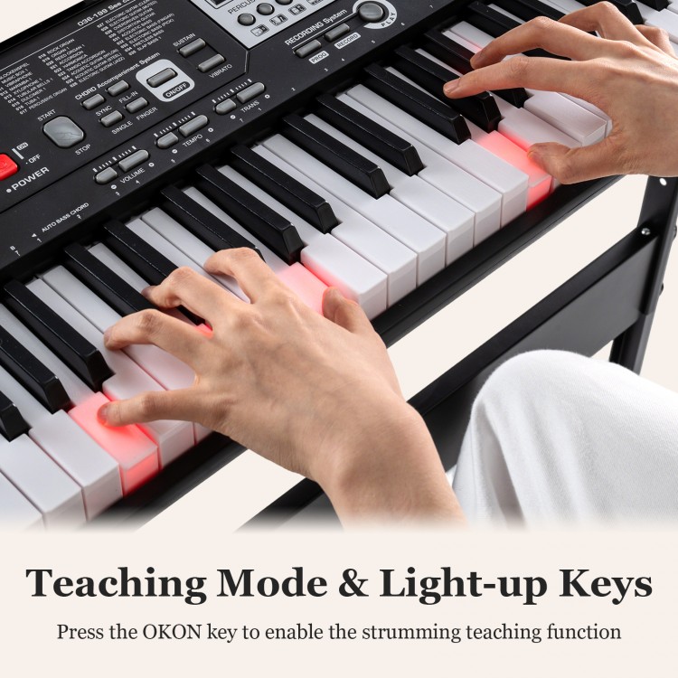 61-key electric keyboard with light-up keys and teaching mode, perfect for beginners, shown with hands on keys.