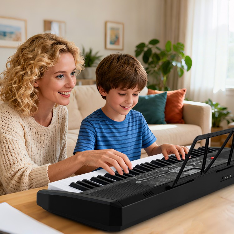 Mom and son playing together on a 61-key portable electric piano keyboard, featuring 200 rhythms and tones.