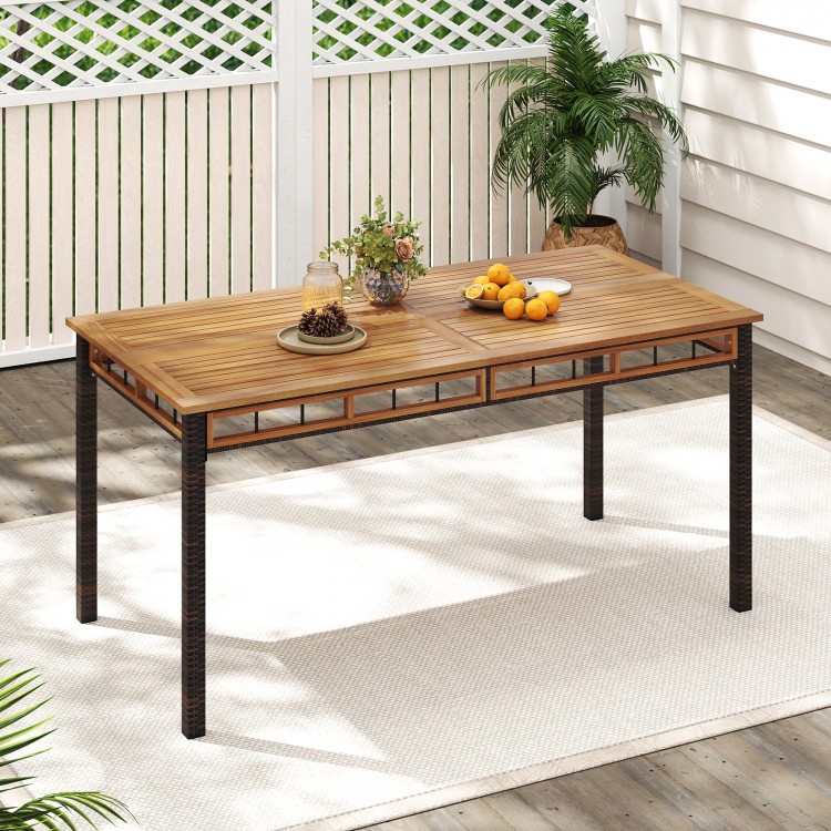 Outdoor dining table featuring a 63" acacia wood slatted top and PE rattan legs, perfect for yard or poolside dining.