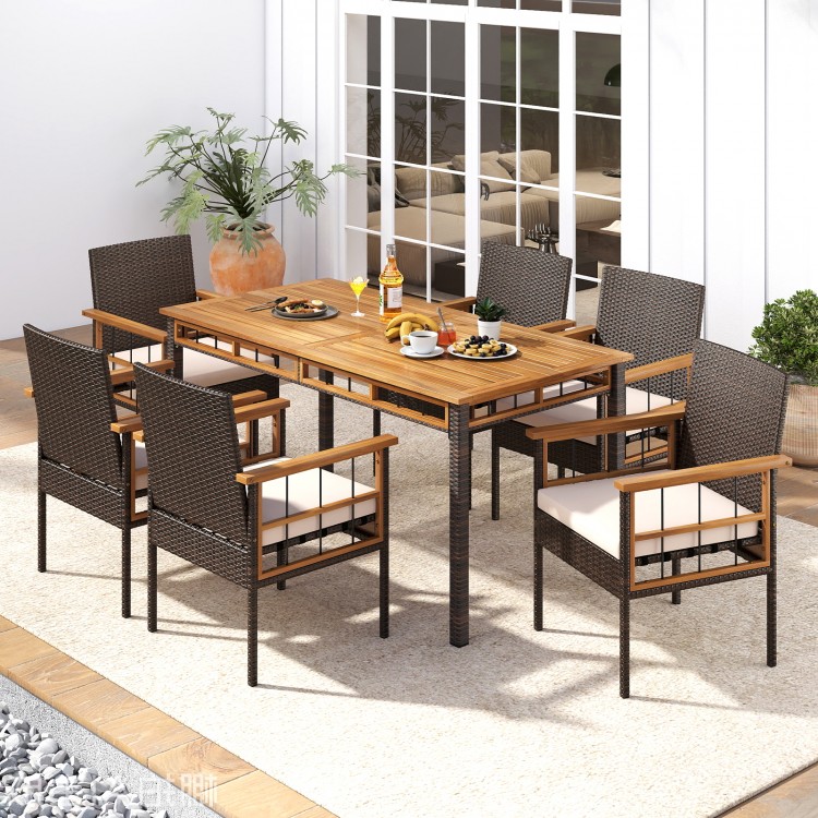 Outdoor dining table featuring a 63" acacia wood slatted top and PE rattan legs, ideal for yard or poolside gatherings.