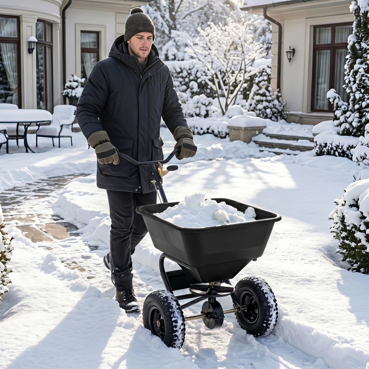 Walk-behind broadcast spreader with 66 lbs capacity, 13-inch all-terrain tires, ideal for efficient snow and lawn spreading.