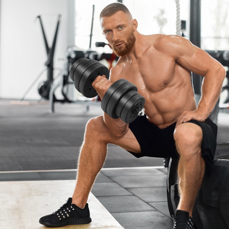 Adjustable 66 lbs fitness dumbbell weight set with ergonomic handle, shown in use for strength training at the gym.