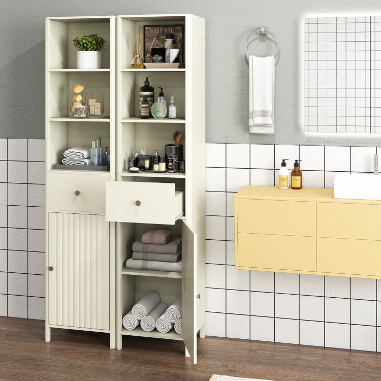 Narrow beige bathroom cabinet with fluted door showing adjustable shelves, smooth drawer slides, and elegant rounded.