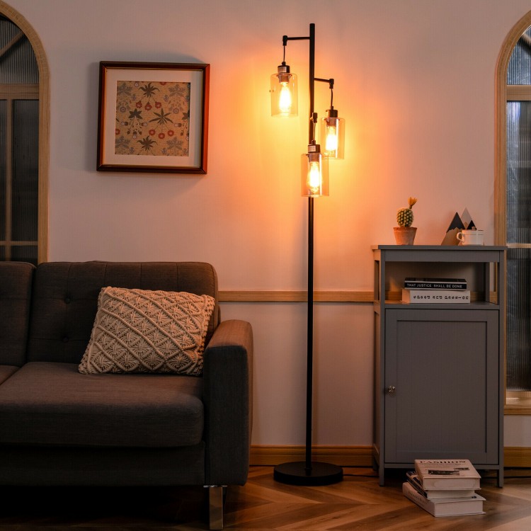 Retro floor lamp with three amber glass shades, featuring a stable iron base, ideal for living room or office lighting.