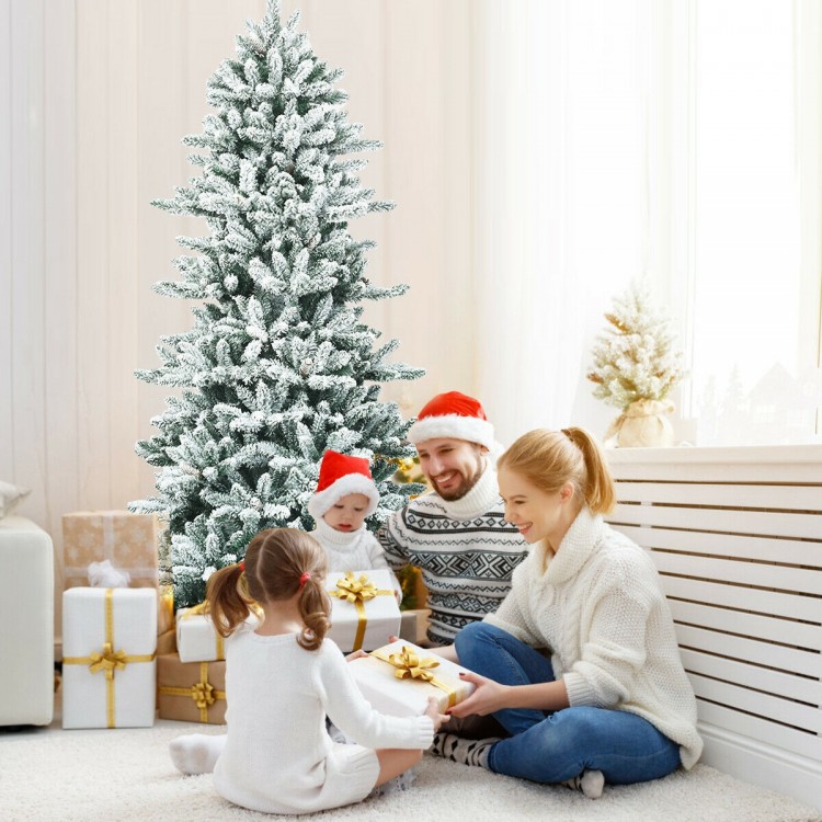 Snow-flocked 7 feet artificial Christmas tree with 1108 branch tips, perfect for creating a festive winter wonderland.