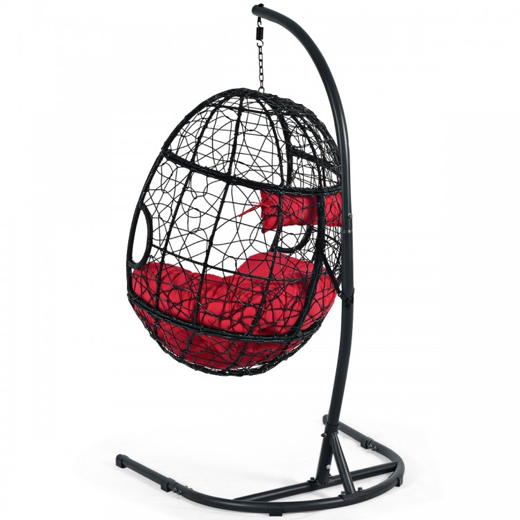 Hanging cushioned hammock chair with stand in black and red, perfect for indoor or outdoor relaxation.