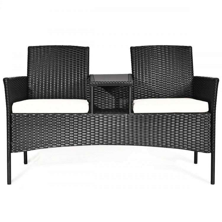 Wicker patio loveseat with removable cushions, featuring weather-resistant rattan and chic design, perfect for outdoor.