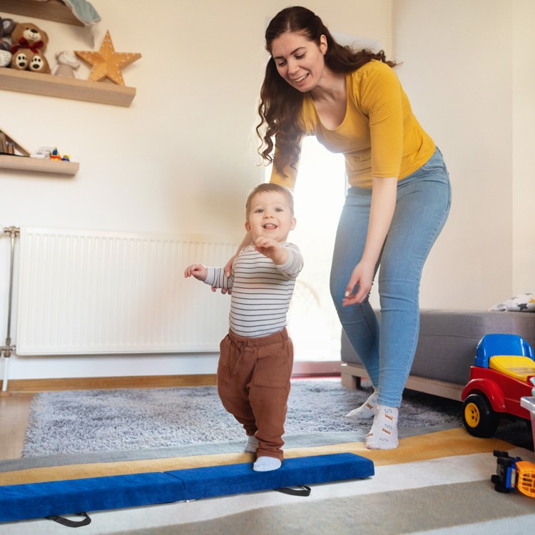 Child practicing on the blue 7 feet folding balance beam with handles, designed for safety and confidence building.