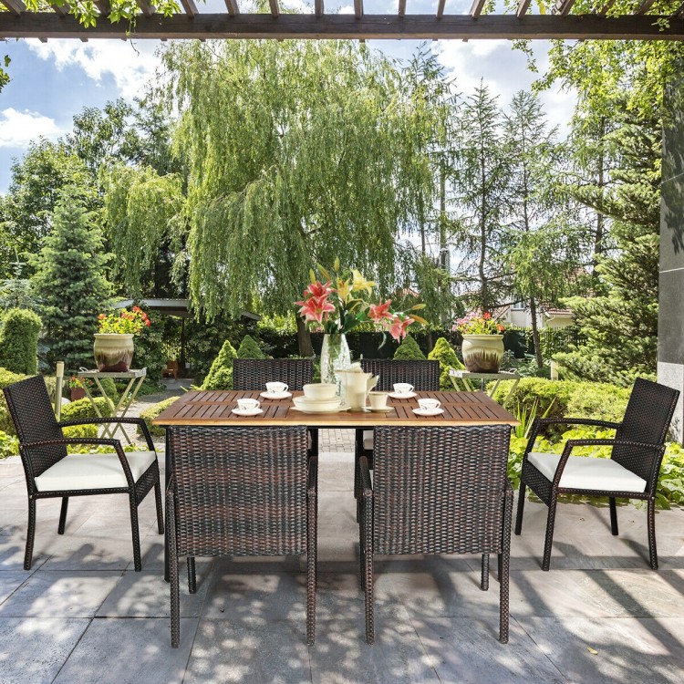 7-piece patio dining set featuring a spacious acacia wood table and 6 cushioned armchairs, perfect for outdoor.