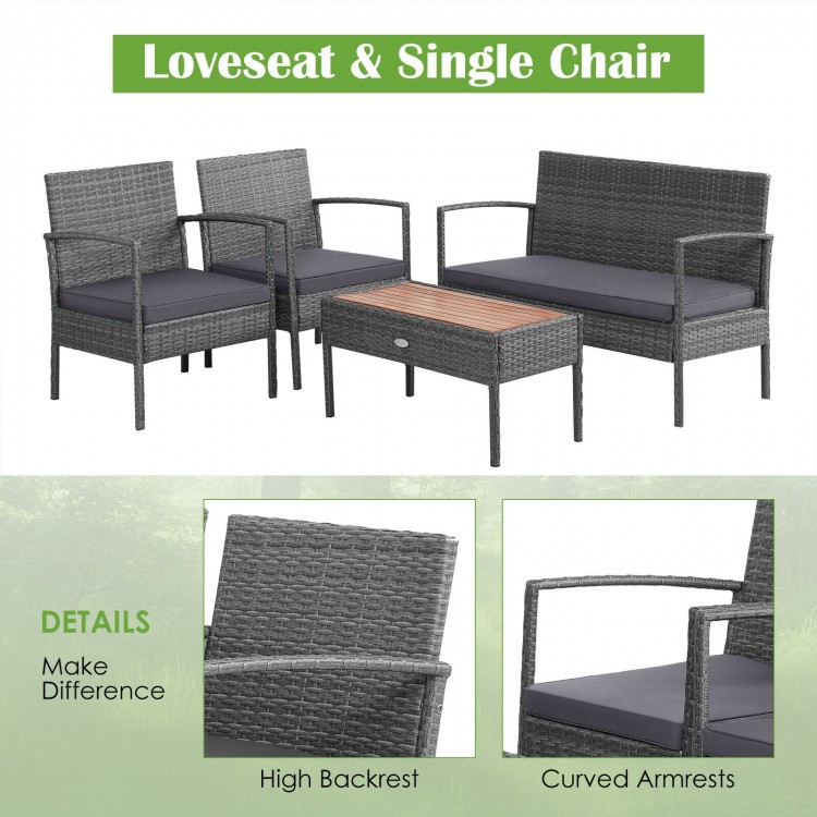 Rattan patio conversation set featuring a loveseat, two single chairs, and an acacia wood coffee table for outdoor.