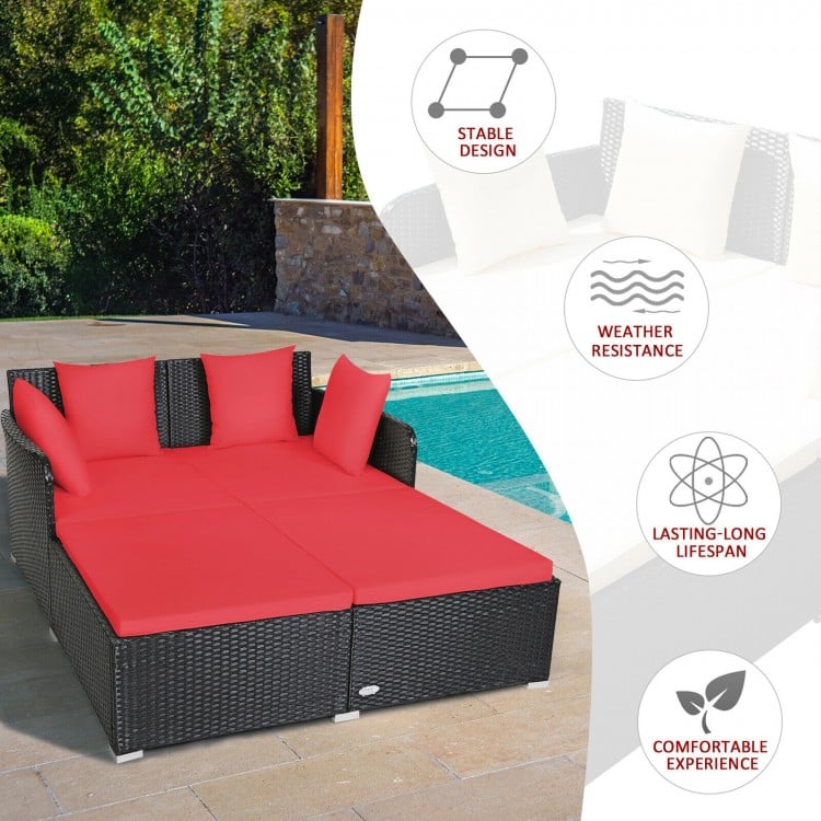 Spacious outdoor rattan daybed with red upholstered cushions, featuring a stable design and weather resistance for.