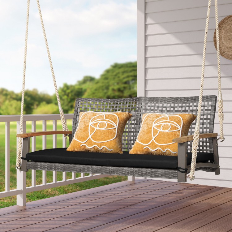 Spacious 2-person patio wicker hanging swing chair in gray PE rattan with black cushion, perfect for outdoor relaxation.