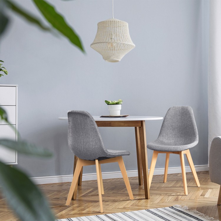 Modern dining chair set with wood legs and fabric cushion seats, perfect for dining rooms or lounges.