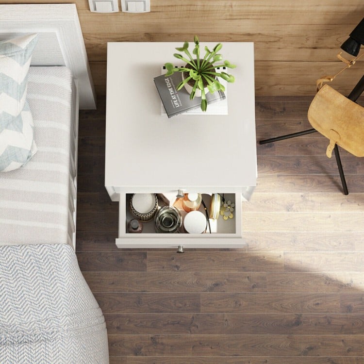 Top view of a white wooden nightstand with two storage drawers, perfect for bedroom decor and efficient space use.
