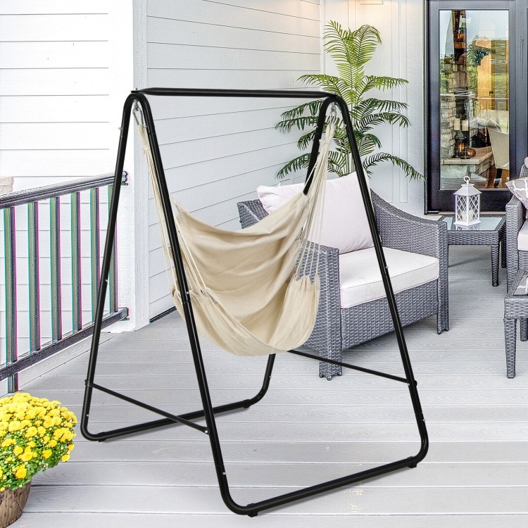 Hanging padded hammock chair with stand in beige, featuring a sturdy steel frame for indoor or outdoor relaxation.