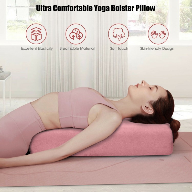 Yoga bolster pillow in pink with washable cover, providing support for yoga exercises and featuring a portable carry.