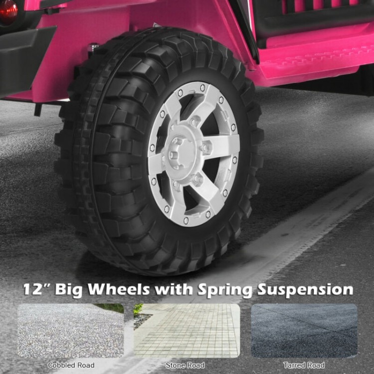 Close-up of the 12-inch big wheels with spring suspension on a pink 12V kids electric ride-on truck for smooth rides.