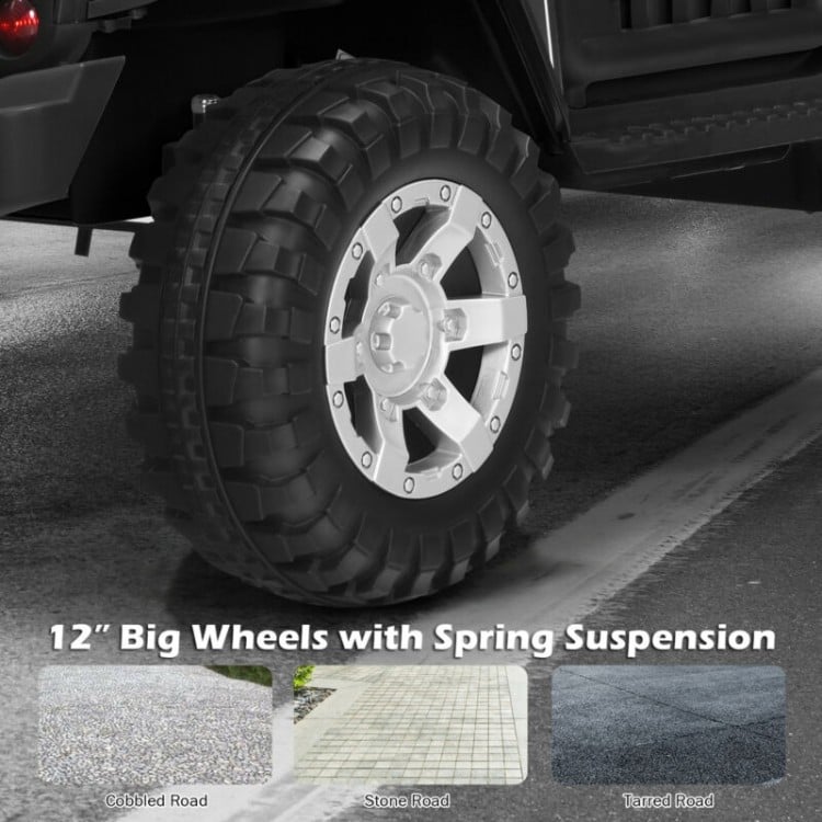 Close-up of a 12" thick plastic wheel with spring suspension for the 12V Kids Electric Ride On Truck, ideal for smooth.