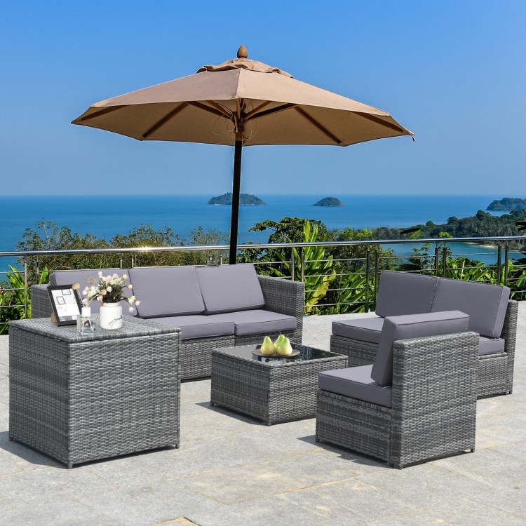 Gray 8-piece wicker sofa rattan dining set with storage table and cushions, ideal for outdoor patio relaxation.