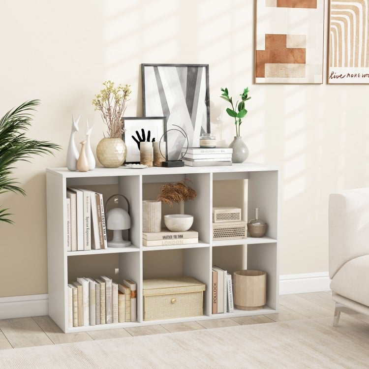 6-cube bookshelf in white showcasing decorative items and plants, enhancing storage and style in any living room or.