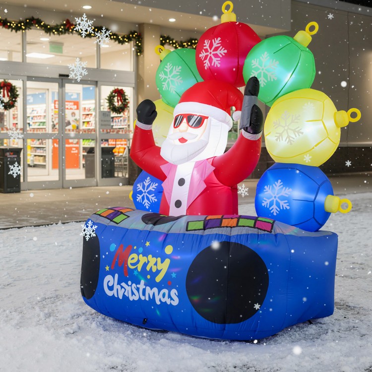 Inflatable DJ Santa with flashing LED lights and rotating music booth, perfect for festive outdoor displays.