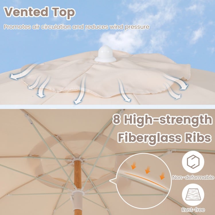 Vented top and fiberglass ribs of a 6 feet patio umbrella with fringe, promoting air circulation and stability.