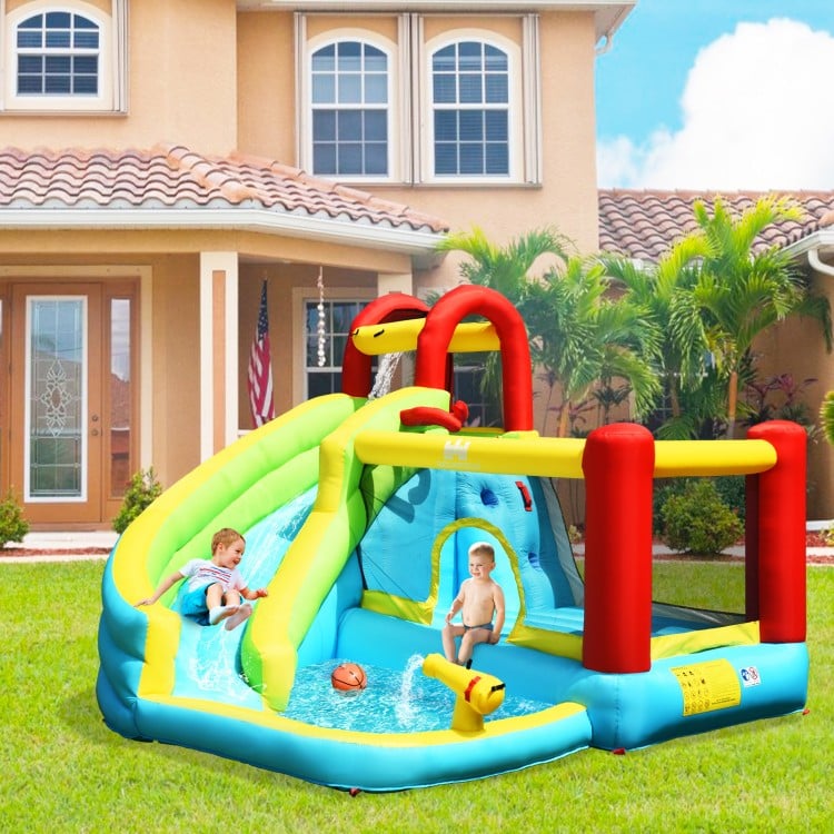 Colorful 6-in-1 inflatable bounce house with water slide, climbing wall, and basketball hoop for backyard fun.