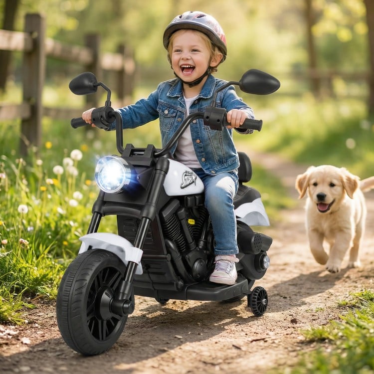 Kids motorcycle in white with headlight, music, and training wheels, perfect for outdoor fun and safety.