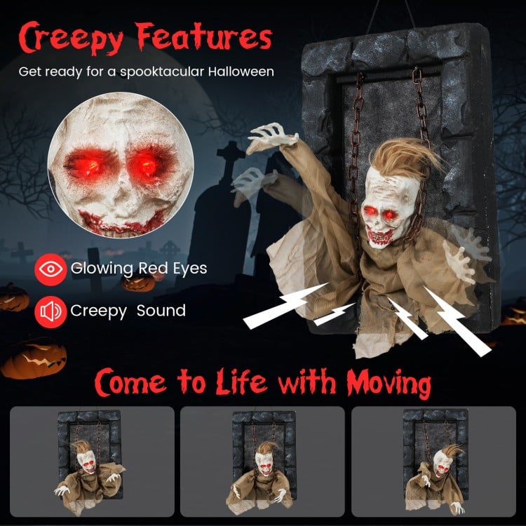 Hanging animated zombie prisoner decoration with glowing red eyes and creepy sound, perfect for Halloween scares.