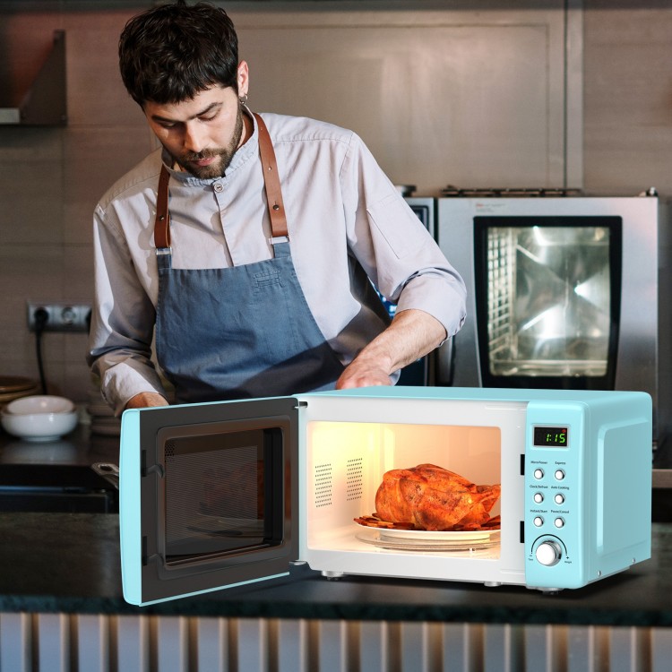 Retro green 700W countertop microwave oven with a rotating glass plate and LED display, ideal for small spaces.