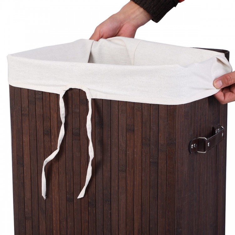 Brown bamboo laundry hamper with removable liner and PU leather handles for easy transport and odor prevention.
