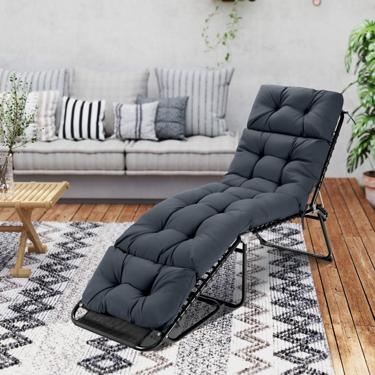 Gray outdoor lounge chaise cushion with high back and four string ties, designed for indoor and outdoor comfort.