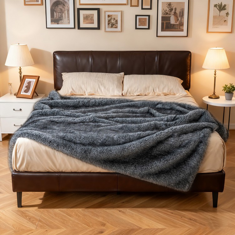 Gray 740GSM soft plush fuzzy faux wolf fur blanket on a bed, perfect for cozy warmth and stylish decor.