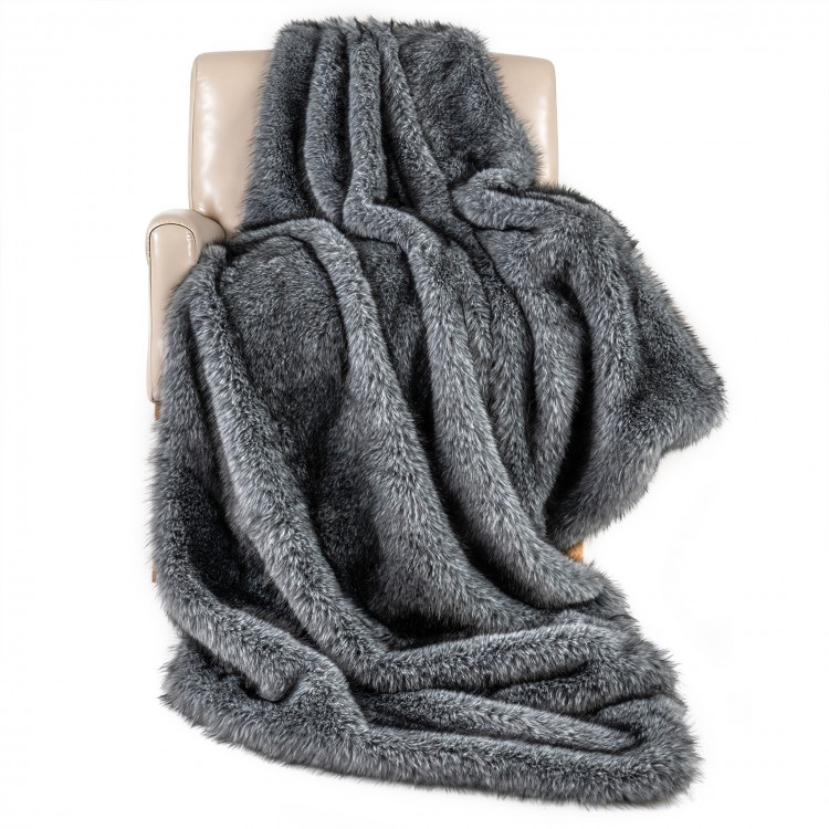 Gray 740GSM soft plush fuzzy luxury faux wolf fur blanket draped over a chair, ideal for sofas and cozy relaxation.