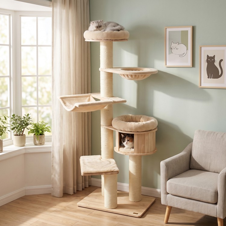 Tall beige cat tree featuring multiple levels, soft cushions, and a rotatable hammock for indoor feline fun.