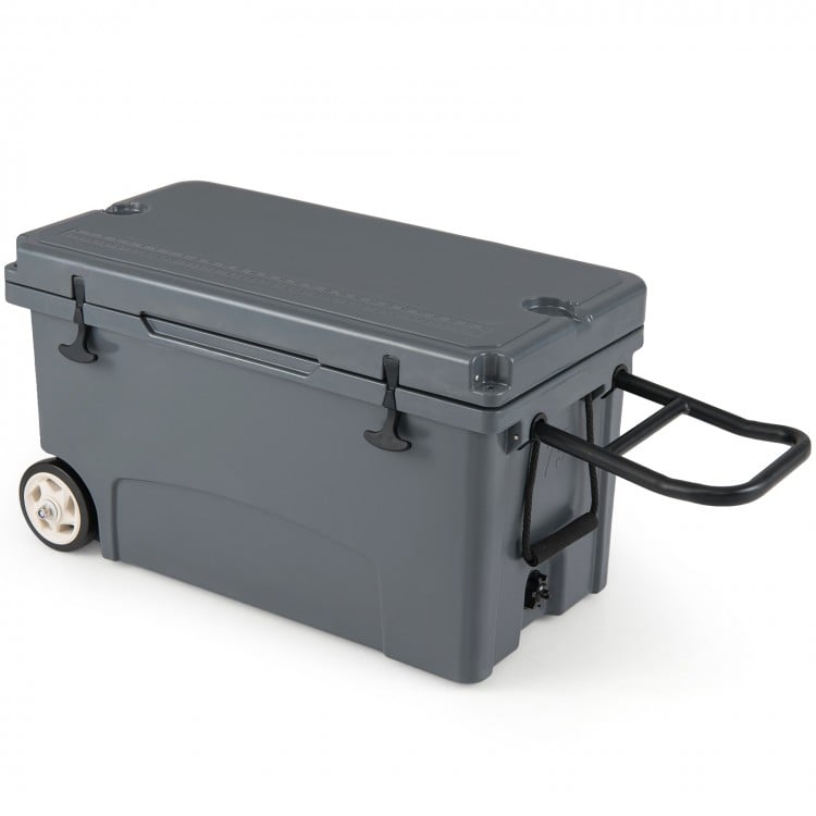 Gray 75 quart portable hard cooler with wheels, pull handle, and dual latches, ideal for camping and outdoor activities.