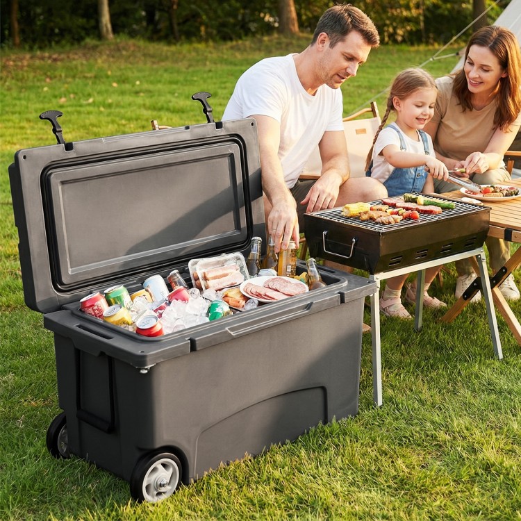 Portable 75 quart hard cooler in gray with wheels, ideal for camping and picnics, featuring 6-day ice retention.