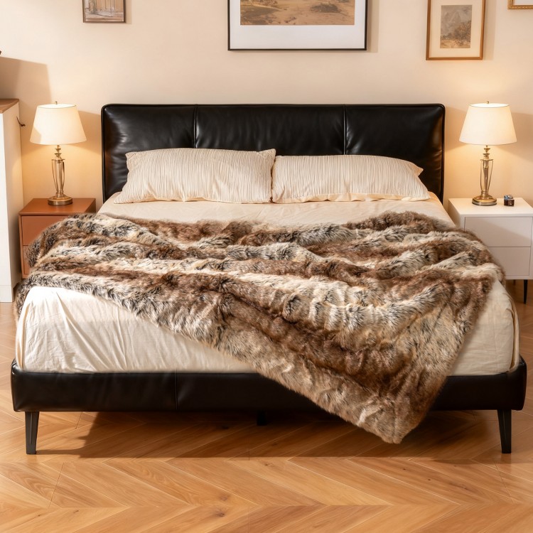 Soft plush fuzzy luxury faux raccoon fur blanket draped over a bed, perfect for warmth and comfort.