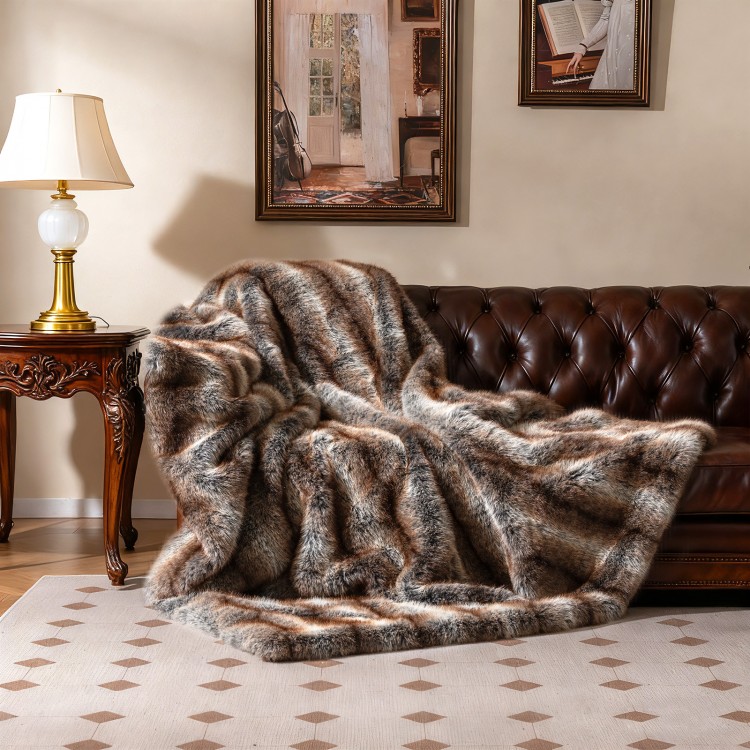 Luxury faux fox fur blanket in brown, featuring a soft texture, perfect for sofas and cozy relaxation.