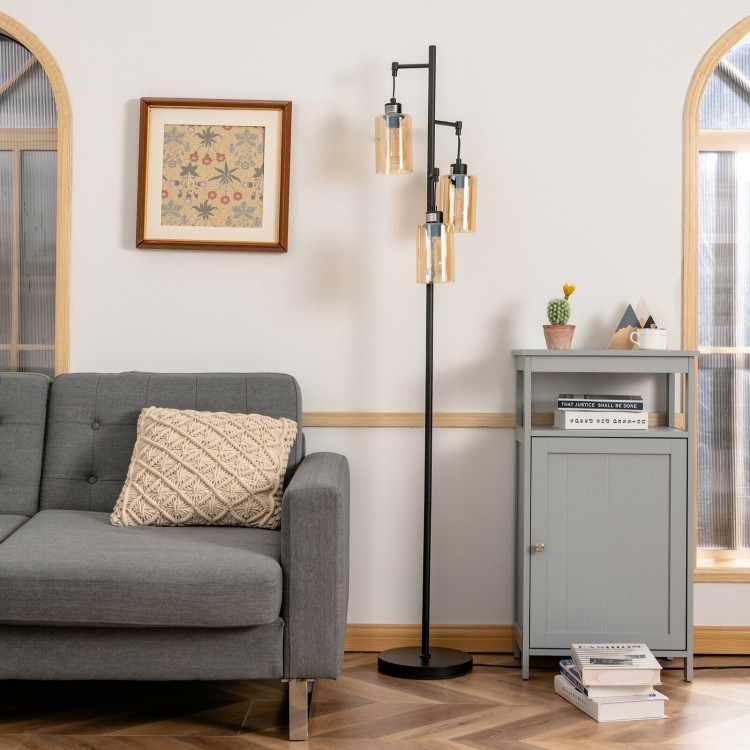 Retro floor lamp with three amber glass shades, featuring a stable iron base, perfect for living room or office use.