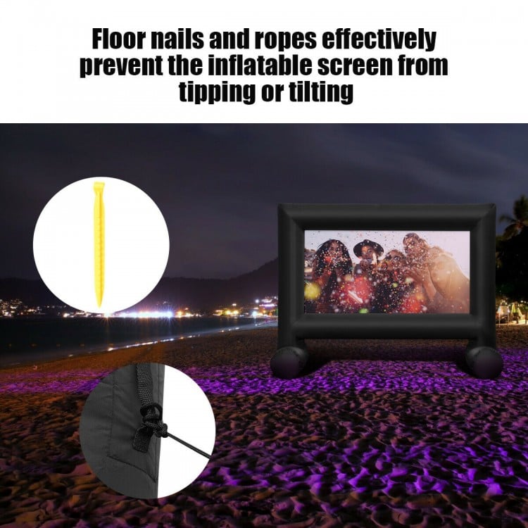 Inflatable outdoor movie projector screen with blower, featuring ground nails and ropes for stability during use.
