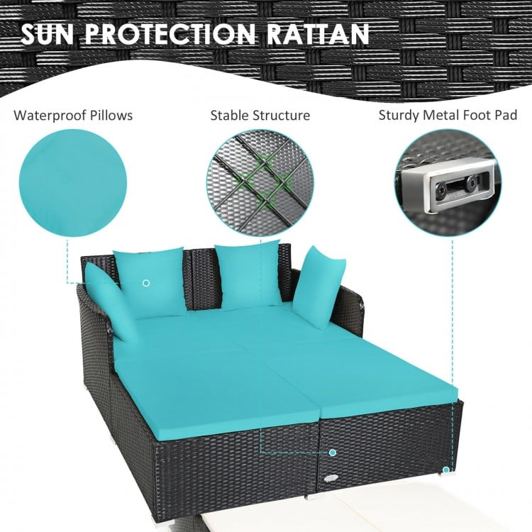 Spacious outdoor rattan daybed in turquoise with waterproof cushions and sturdy metal foot pad for comfort and support.