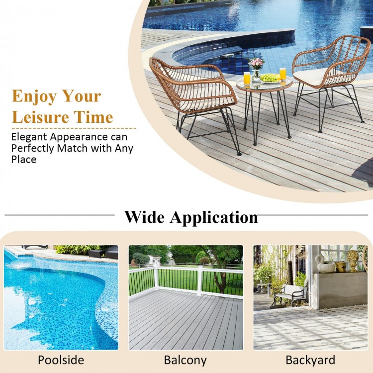 3-piece patio rattan bistro set featuring white cushions, ideal for poolside or balcony relaxation.