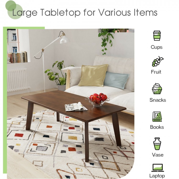 Rectangular wooden coffee table with rubber legs, large scratch-resistant tabletop, ideal for various items and easy to.