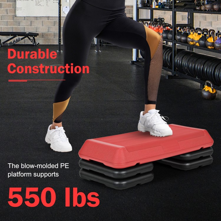 Adjustable red aerobic stepper platform with 4 risers, supports 550 lbs, ideal for various cardio exercises at home or.