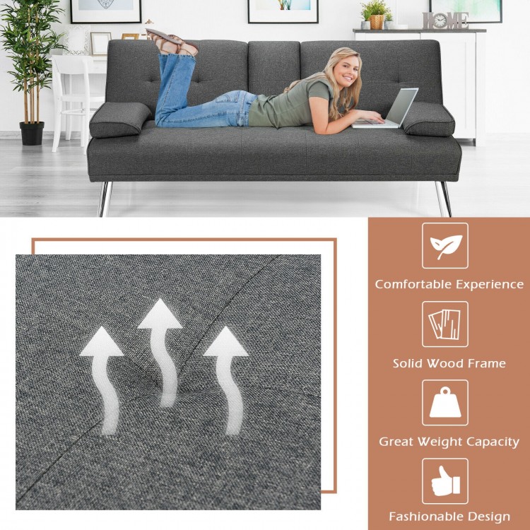 Convertible dark gray futon sofa bed with removable armrests and cup holders, perfect for apartments and versatile use.