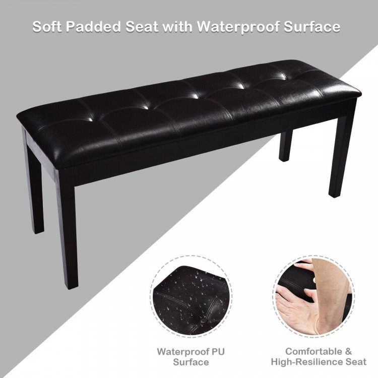 Upholstered dining room bench with button tufting, brown PU surface, and solid rubberwood legs for comfortable seating.
