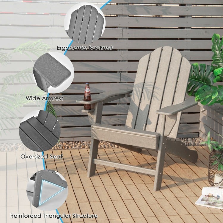 Gray outdoor Adirondack chair with ergonomic backrest and built-in cup holder, ideal for backyard and patio use.