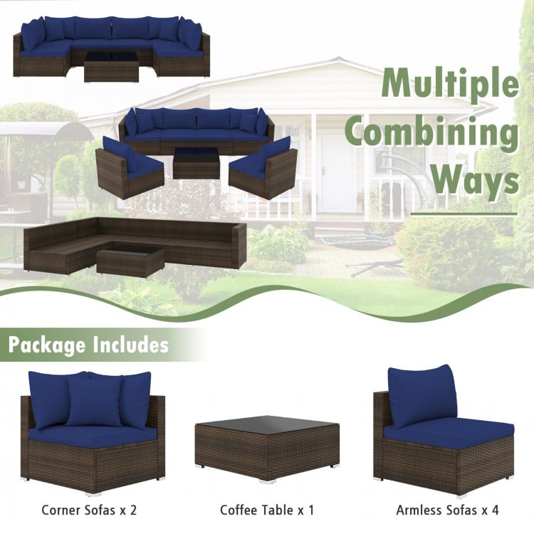 Sectional patio rattan furniture set with navy cushions, including 2 corner sofas, 4 armless sofas, and a coffee table.