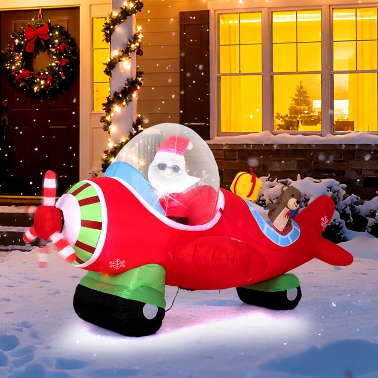 Christmas inflatable airplane featuring Santa Claus, a bear, and gift boxes, with built-in LED lights for outdoor.